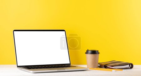 Photo for Laptop with blank screen for your message, app or web and coffee cup. Computer with white display - Royalty Free Image