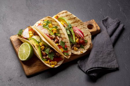 Photo for Mexican food featuring tacos with meat and grilled vegetables - Royalty Free Image