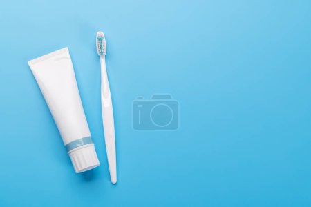Photo for A clean and refreshing image featuring toothpaste and toothbrush, promoting oral hygiene and a bright smile. Flat lay with copy space - Royalty Free Image