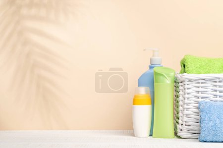 Photo for Body care items and bathroom towels on table with space for your product or text. Spa arrangement - Royalty Free Image