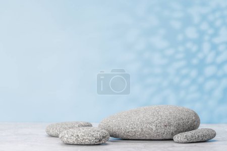 Photo for A visually appealing backdrop with smooth sea pebbles and ample copy space, perfect podium for showcasing your product - Royalty Free Image
