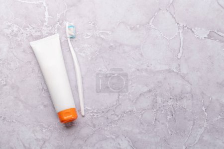 Photo for A clean and refreshing image featuring toothpaste and toothbrush, promoting oral hygiene and a bright smile. Flat lay with copy space - Royalty Free Image