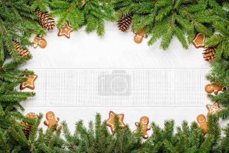 Photo for Christmas fir tree branch with decor, cookies and space for greetings text. Flat lay - Royalty Free Image
