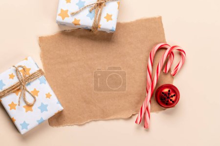 Photo for Christmas gift boxes, candy cane and space for Xmas greetings text. Flat lay - Royalty Free Image