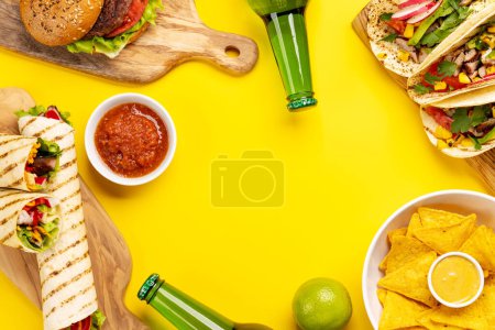 Photo for Mexican food featuring tacos, burritos, nachos, burgers and more. Flat lay with copy space - Royalty Free Image