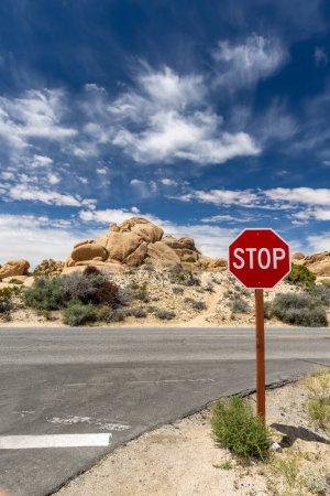 Photo for A simple yet powerful photo of cross roads and a stop sign, representing the choices and decisions we make in life - Royalty Free Image