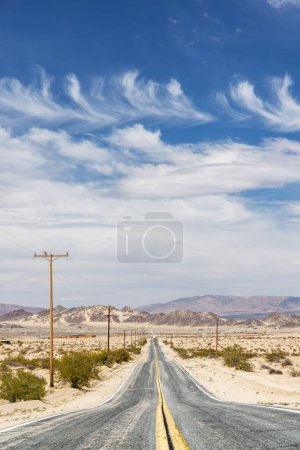 Photo for The perspective of a never-ending road, the journey of travel and adventure towards a beautiful destination - Royalty Free Image