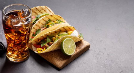 Photo for Mexican food featuring tacos with meat and grilled vegetables. With copy space - Royalty Free Image