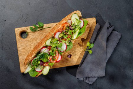 Photo for Delicious vegetarian sandwich stuffed in a fresh baguette, bursting with flavor and wholesome ingredients - Royalty Free Image
