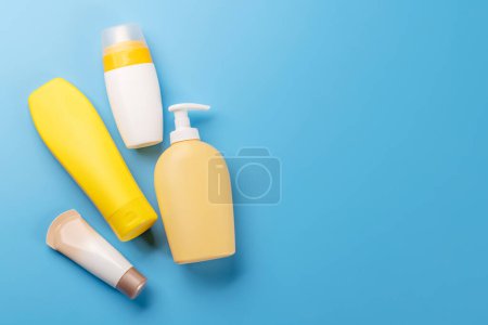 Photo for A vibrant collection of toiletry tubes, perfect for everyday personal care. Flat lay with copy space - Royalty Free Image