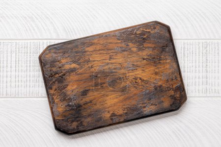 Photo for Wooden cutting board on kitchen table. Flat lay with copy space - Royalty Free Image