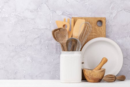Téléchargez les photos : Kitchen utensils on wooden table. Front view with copy space - en image libre de droit