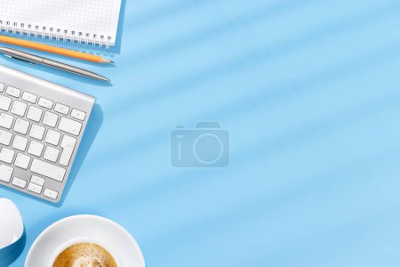 Photo for Top view business office desk with keyboard, office supplies and coffee. Flat lay workspace with sunny light and copy space - Royalty Free Image