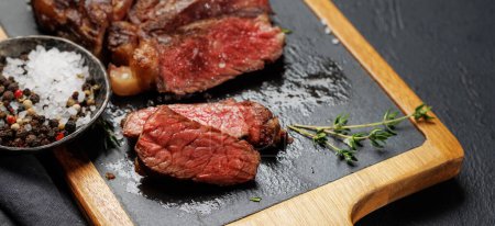 Photo for Deliciously juicy sliced beef ribeye steak, perfectly cooked and ready to be savored - Royalty Free Image