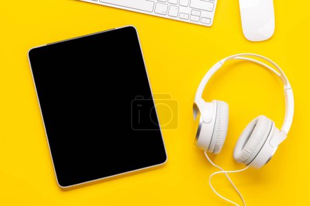 Photo for Gaming gear and tech accessories on a yellow background, perfect for gaming and tech-related themes. Flat lay - Royalty Free Image