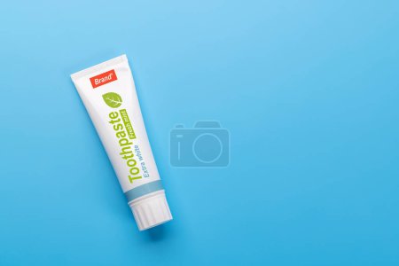 A clean and refreshing image featuring toothpaste, promoting oral hygiene and a bright smile. Flat lay with copy space