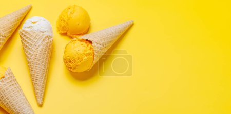 Photo for Assorted ice cream flavours in delightful waffle cones, a treat for every taste bud. Over yellow background with copy space - Royalty Free Image