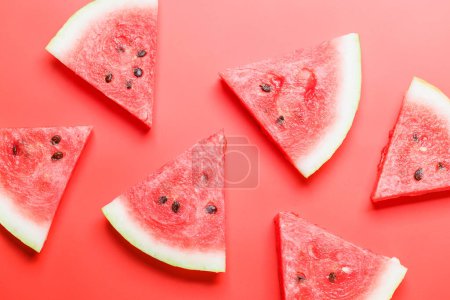 Photo for Juicy watermelon slices on a vibrant red background, a refreshing summer treat. Flat lay - Royalty Free Image