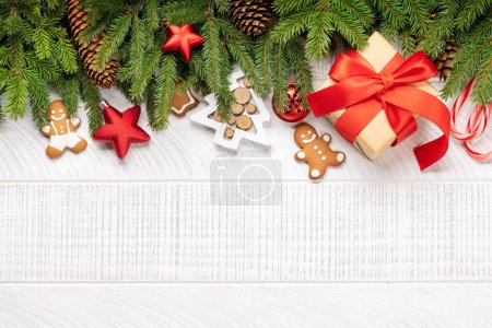 Photo for Xmas fir tree branch with decor, Christmas gift box and space for greetings text. Flat lay - Royalty Free Image