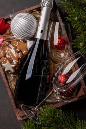 Photo for Box with Christmas gingerbread cookies and champagne. Flat lay - Royalty Free Image
