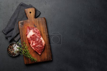 Photo for Raw beef ribeye steak, fresh and ready for cooking, promising a mouthwatering culinary experience. Flat lay with copy space - Royalty Free Image