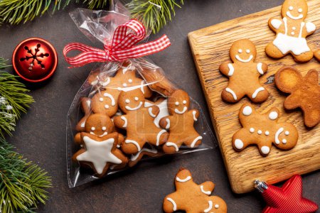 Photo for Gingerbread man cookies in gift package. Christmas holiday card - Royalty Free Image