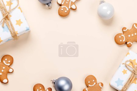 Photo for Christmas gift boxes, gingerbread cookies and space for Xmas greetings text. Flat lay - Royalty Free Image