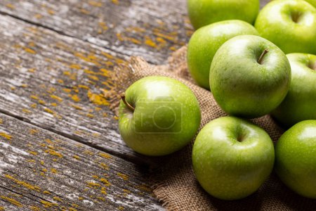 Photo for Fresh green apples on wood table. With copy space - Royalty Free Image
