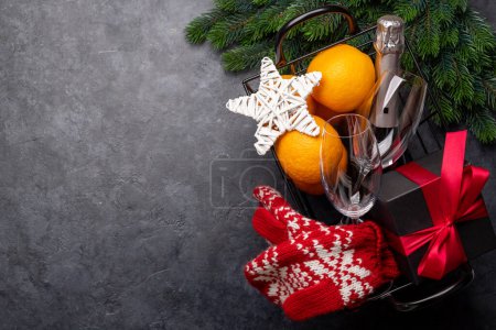 Photo for Christmas gift box with champagne, oranges and decor. Flat lay with space for your greetings - Royalty Free Image
