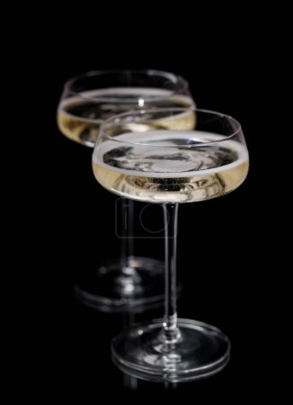 Photo for Two champagne glasses on a black background - Royalty Free Image