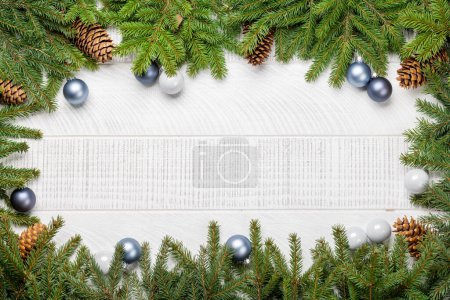 Photo for Christmas fir tree branch with decor and space for greetings text. Flat lay - Royalty Free Image