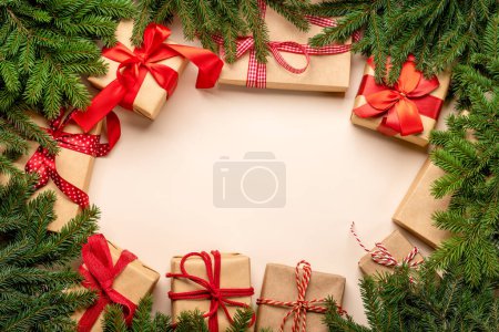 Photo for Xmas fir tree branch, Christmas gift boxes and space for greetings text. Flat lay - Royalty Free Image