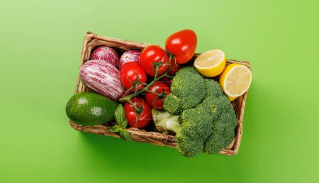 Photo for Variety of vegetables. Flat lay over green background - Royalty Free Image