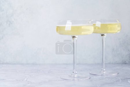 Photo for Two champagne glasses on a stone background - Royalty Free Image