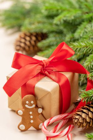 Photo for Xmas fir tree branch, Christmas gift box, gingerbread cookie - Royalty Free Image