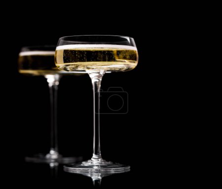 Photo for Two champagne glasses on a black background - Royalty Free Image