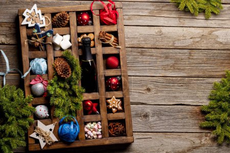 Photo for Wooden box with Christmas decor and toys. Flat lay with copy space - Royalty Free Image