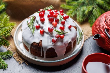 Photo for Delicious Christmas cake and tea, a festive holiday treat - Royalty Free Image