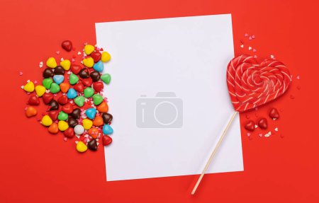 Foto de Candy sweets and greeting card for your greetings. Valentines day candy hearts. Flat lay - Imagen libre de derechos