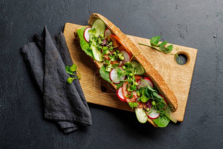Photo for Delicious vegetarian sandwich stuffed in a fresh baguette, bursting with flavor and wholesome ingredients - Royalty Free Image
