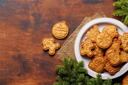 Photo for Diverse Christmas gingerbread cookies, festive sweetness. Flat lay with copy space - Royalty Free Image