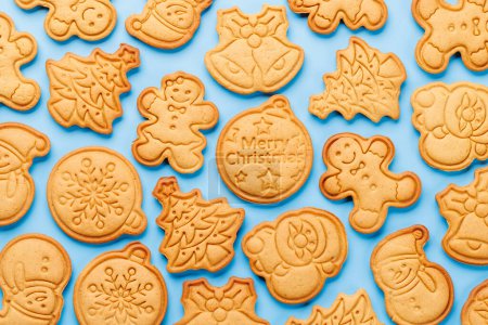 Photo for Diverse Christmas gingerbread cookies, festive sweetness. Flat lay - Royalty Free Image