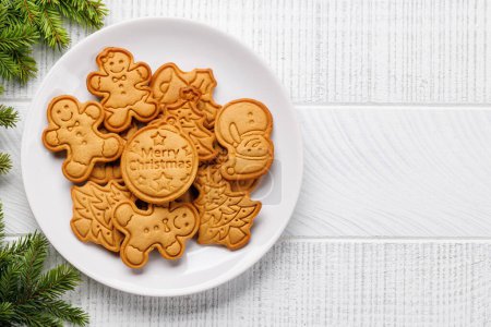Photo for Diverse Christmas gingerbread cookies, festive sweetness. Flat lay with copy space - Royalty Free Image