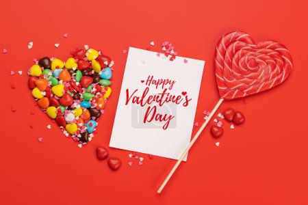 Foto de Candy sweets and greeting card for your greetings. Valentines day candy hearts. Flat lay - Imagen libre de derechos