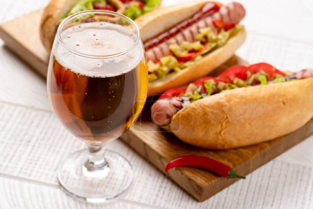 Photo for Various hot dog and beer. Homemade hotdogs on cutting board - Royalty Free Image