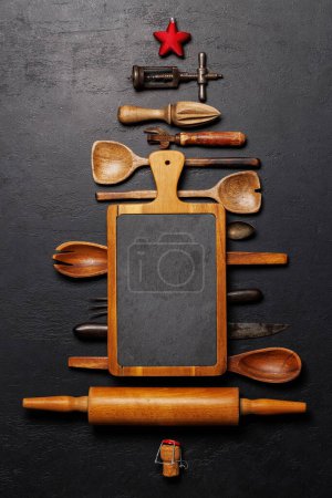 Photo for Festive culinary flair: Christmas tree-shaped cooking utensils. Flat lay with copy space - Royalty Free Image