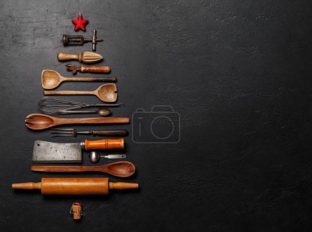 Photo for Festive culinary flair: Christmas tree-shaped cooking utensils. Flat lay with copy space - Royalty Free Image