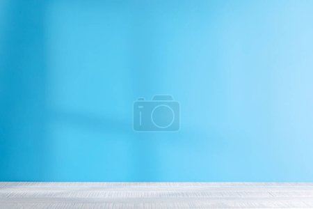 Photo for A light background with captivating shadows on the wall, serving as an ideal template or backdrop for product presentations - Royalty Free Image