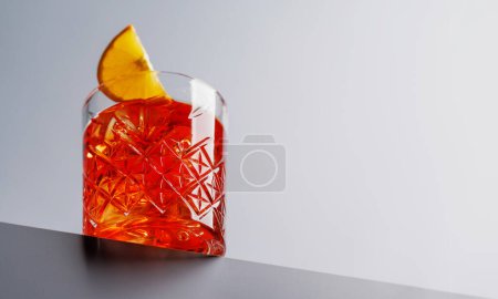 Photo for Cocktail delight: Classic negroni against a grey background with copy space - Royalty Free Image