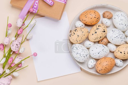 Photo for Easter delights: Colorful eggs in a festive arrangement and gift box. Flat lay with card copy space - Royalty Free Image